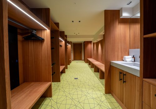 Spacious wooden locker room interior.