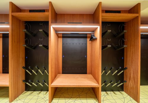 Wooden lockers with ski equipment holders.